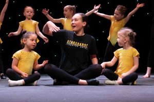 Stageskool Stage Tots on stage dancing with their teacher